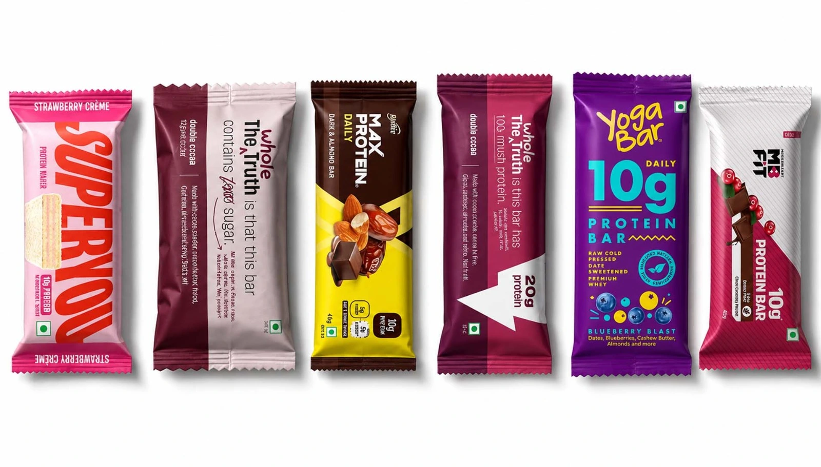 Selection of protein bars from different brands, including strawberry, chocolate, and berry-flavored options.