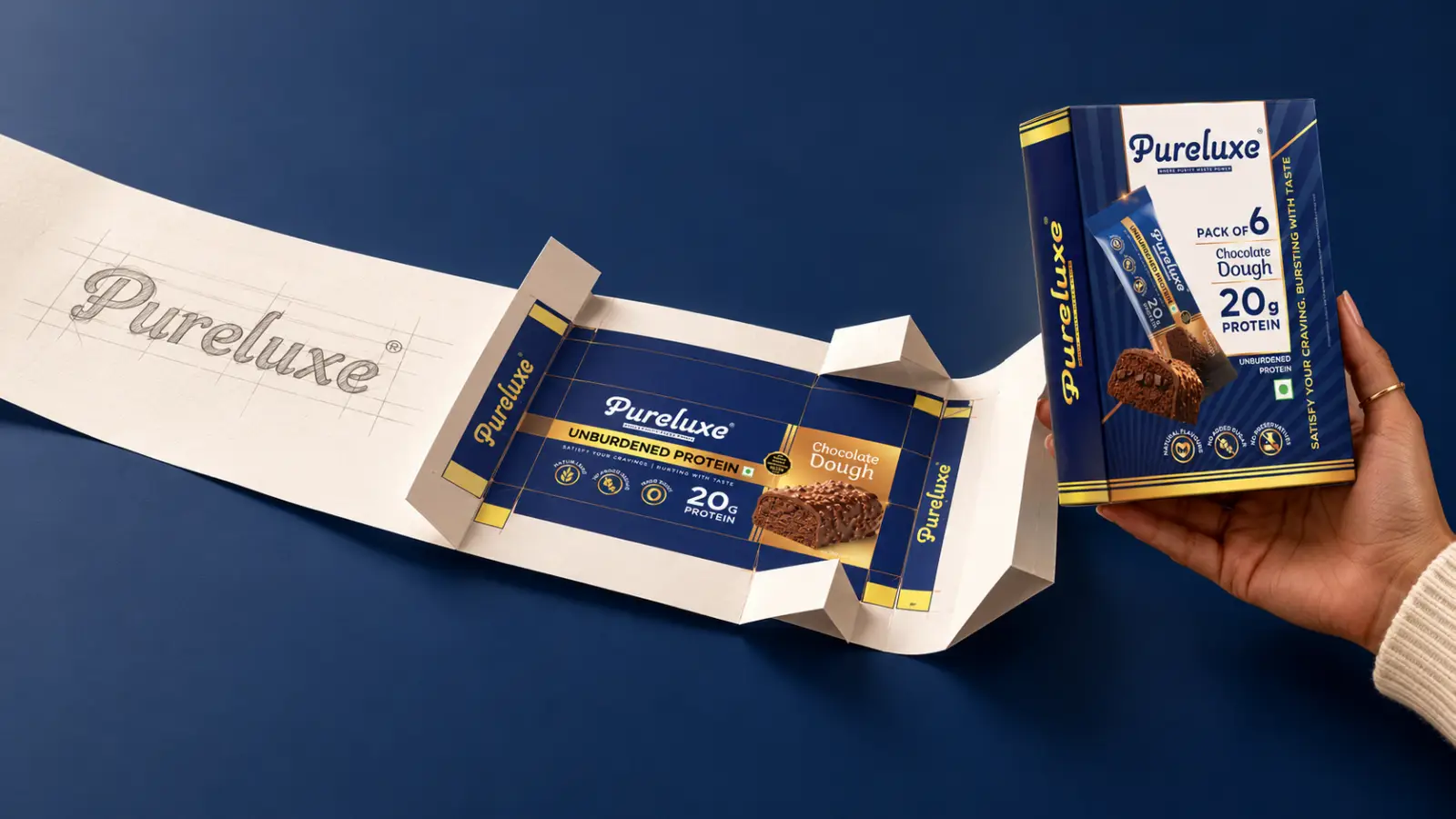 Product packaging design by DN Designs showing a flat layout sketch, unfolded wrapper, and finished box of Pureluxe Chocolate Dough protein bars against a dark blue background.
